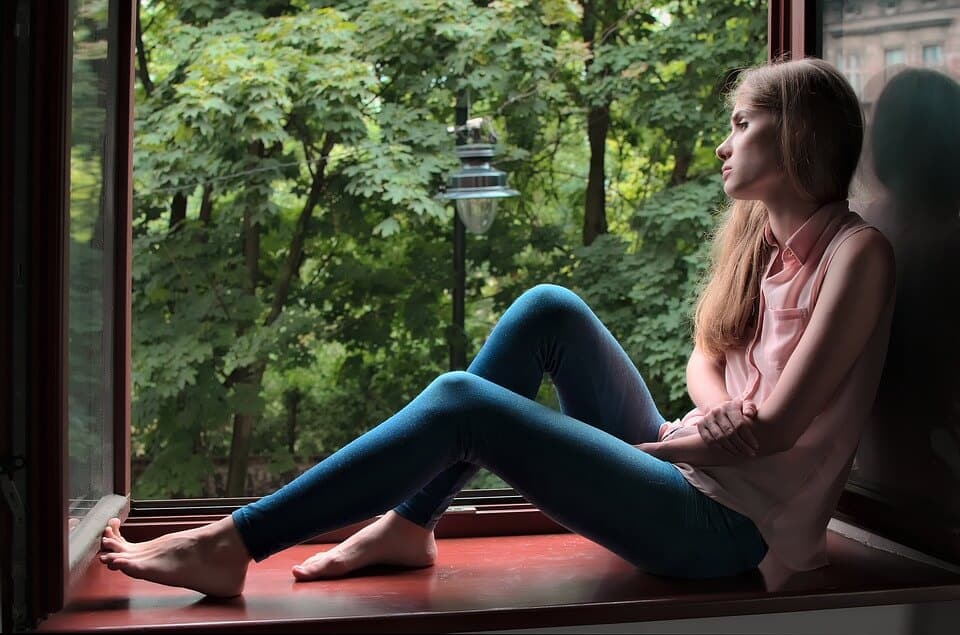 Girl looking out window
