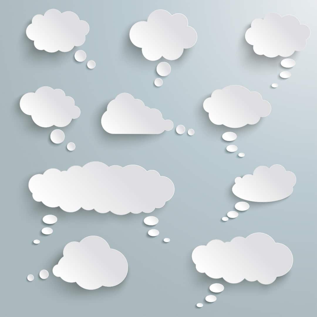Paper cutouts of thought bubbles on a light blue background.